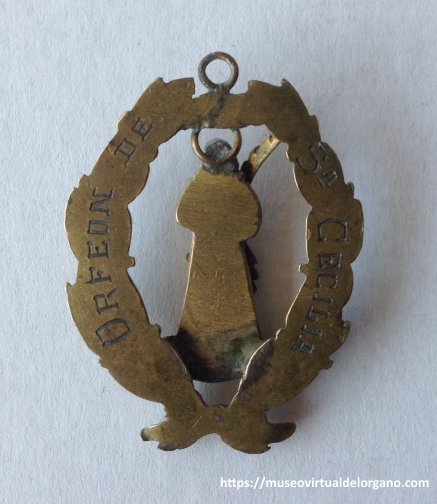 Medalla de Santa Cecilia portando un órgano, en el reverso inscripción del Orfeón de Santa Cecilia, medalla en bronce, ca. 1890–1930 [reverso]